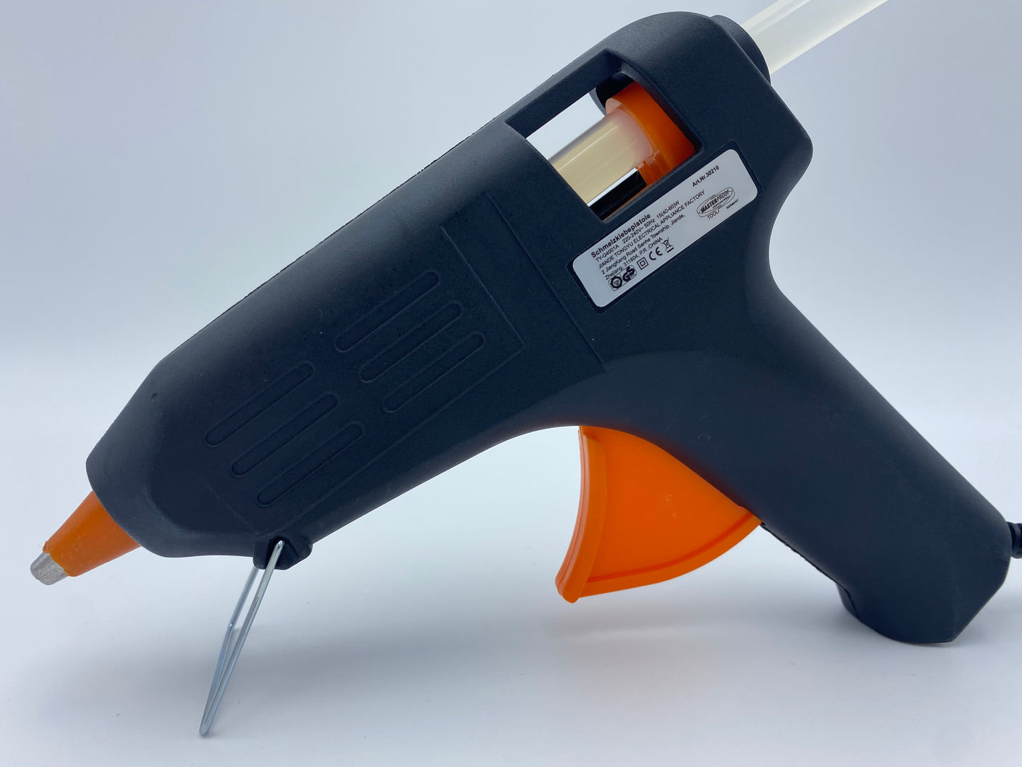 Heißklebepistole mit 11-mm-Durchmesser, inklusive 10 Hotmelt Klebesticks, auf weißem Hintergrund. Die Pistole ist ergonomisch gestaltet, mit einem stabilen Griff und einer spitzen Düse für präzise Anwendungen in Handwerk und Reparatur.